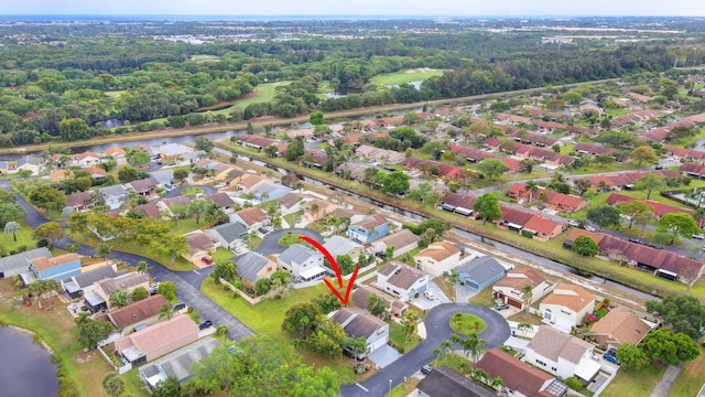 aerial view featuring a residential view and a water view