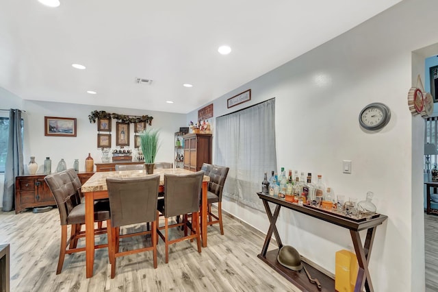 dining room featuring visible vents, recessed lighting, and light wood-style floors