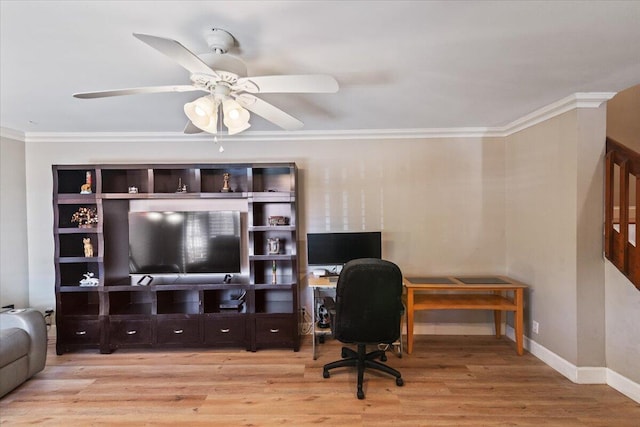 office with baseboards, a ceiling fan, wood finished floors, and crown molding