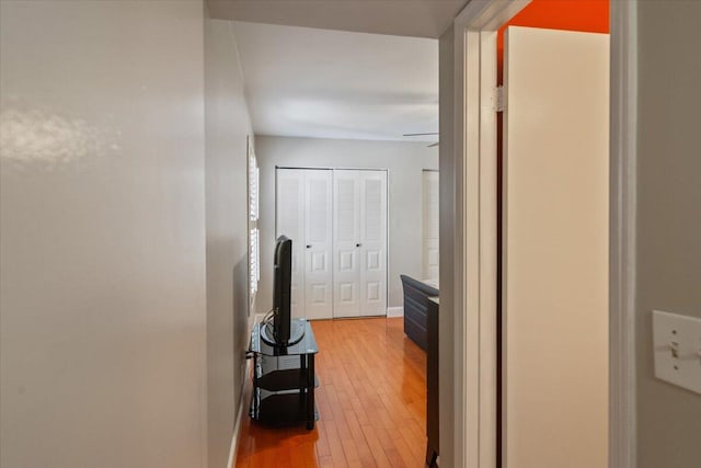 corridor with light wood finished floors