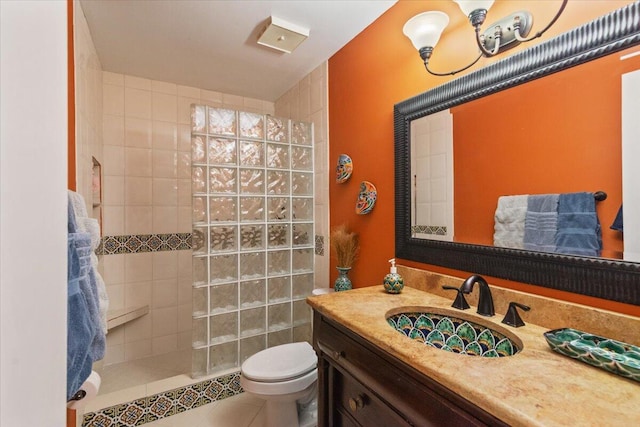 full bath with tile patterned floors, toilet, walk in shower, and vanity