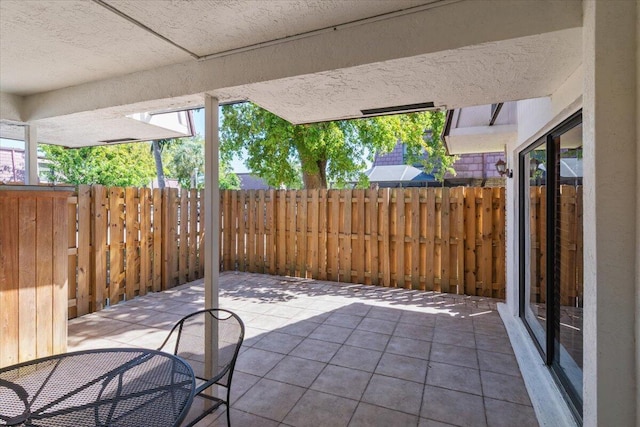 view of patio featuring fence