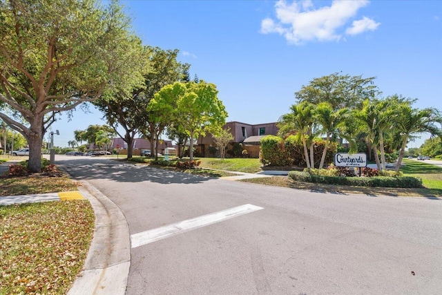 view of road with curbs and sidewalks