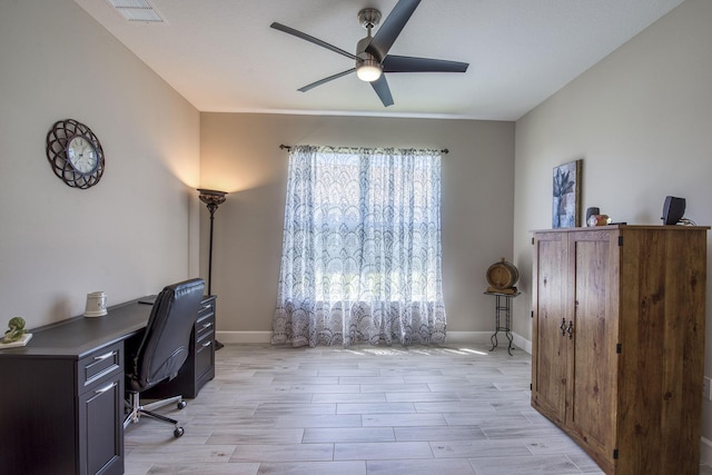 office area with visible vents, baseboards, ceiling fan, and light wood finished floors