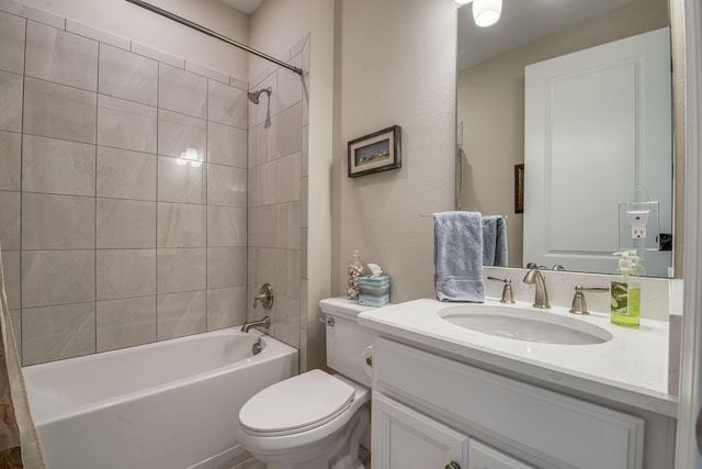 bathroom featuring tub / shower combination, toilet, and vanity