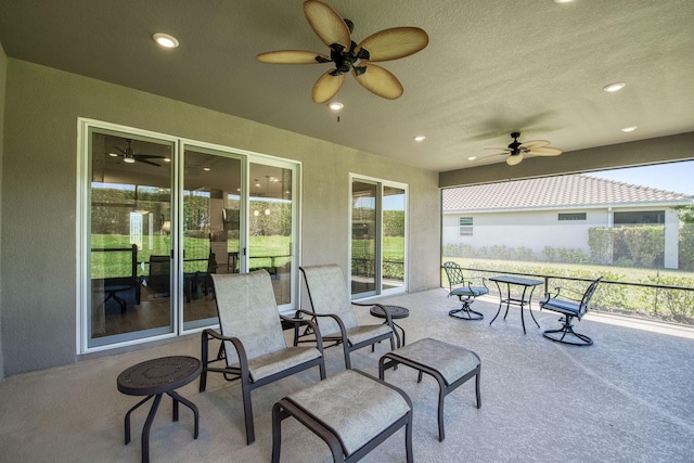 view of patio featuring ceiling fan