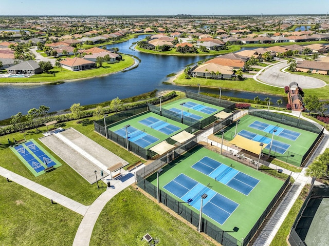 bird's eye view featuring a residential view and a water view