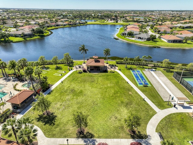 bird's eye view featuring a residential view and a water view