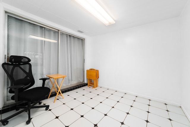office area featuring tile patterned floors, baseboards, and visible vents