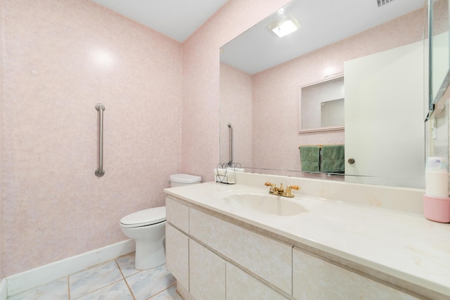 bathroom with visible vents, toilet, tile patterned flooring, baseboards, and vanity