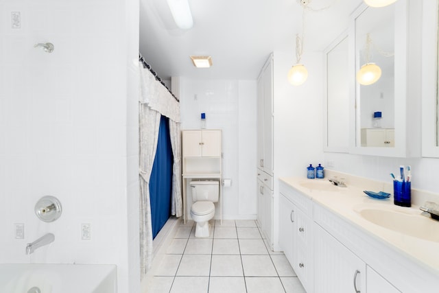 full bath with a sink, a shower with curtain, toilet, and tile patterned floors