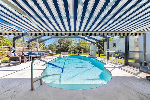 pool featuring a patio area, glass enclosure, and outdoor lounge area