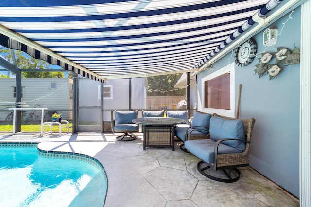 view of pool with a fenced in pool, outdoor lounge area, a patio, and fence
