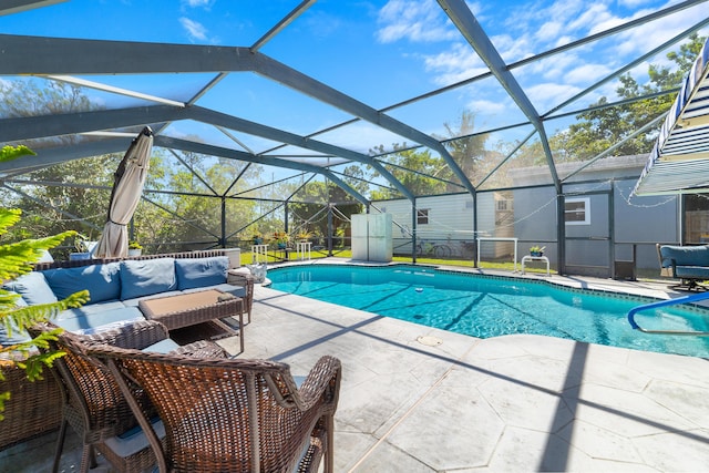 outdoor pool featuring glass enclosure, an outdoor hangout area, and a patio