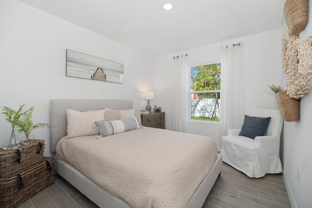 bedroom featuring recessed lighting, baseboards, and wood finish floors