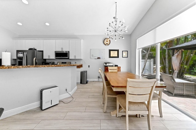 5822 Saddle Trail Ln, Lake Worth, FL 33449 - dining room featuring lofted ceiling, recessed lighting, a chandelier, and light wood-style floors