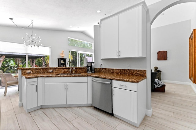5822 Saddle Trail Ln, Lake Worth, FL 33449 - kitchen with stainless steel dishwasher, vaulted ceiling, a peninsula, white cabinetry, and recessed lighting