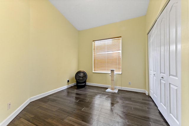5822 Saddle Trail Ln, Lake Worth, FL 33449 - unfurnished bedroom featuring dark wood-type flooring, lofted ceiling, and a closet