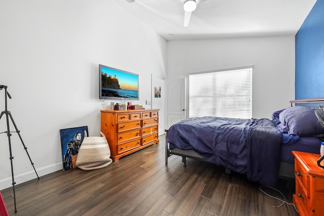 bedroom featuring ceiling fan, lofted ceiling, and wood finished floors