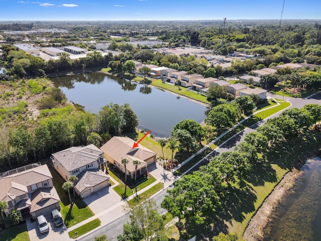 bird's eye view with a residential view and a water view