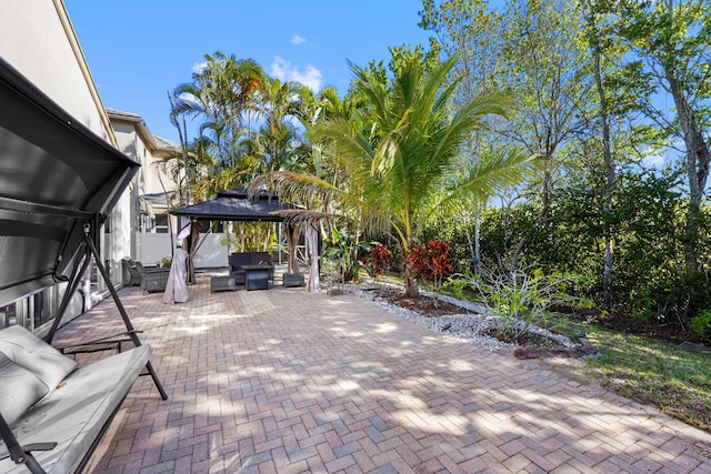 view of patio / terrace featuring a gazebo and fence