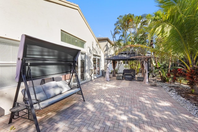 view of patio with a gazebo and an outdoor living space