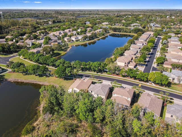 birds eye view of property featuring a residential view and a water view