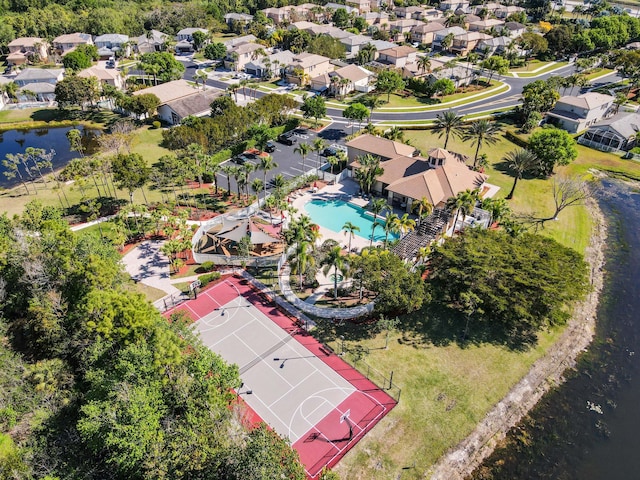 drone / aerial view featuring a residential view and a water view