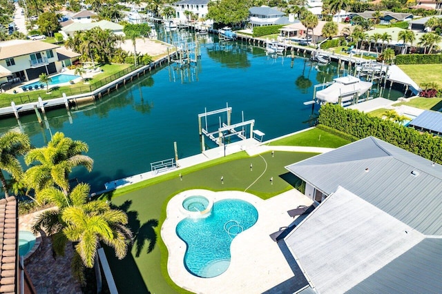 bird's eye view with a residential view and a water view