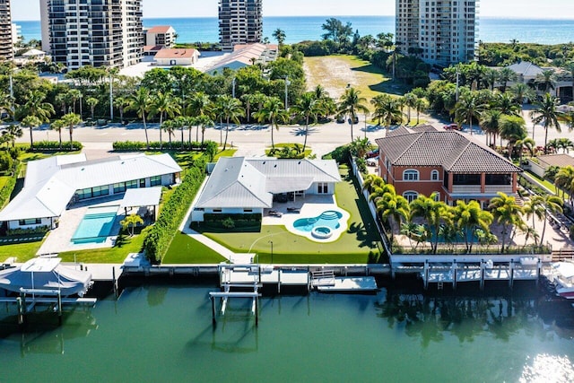 birds eye view of property with a water view