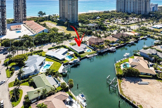 aerial view featuring a view of city and a water view