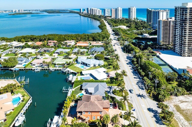 birds eye view of property with a water view and a residential view