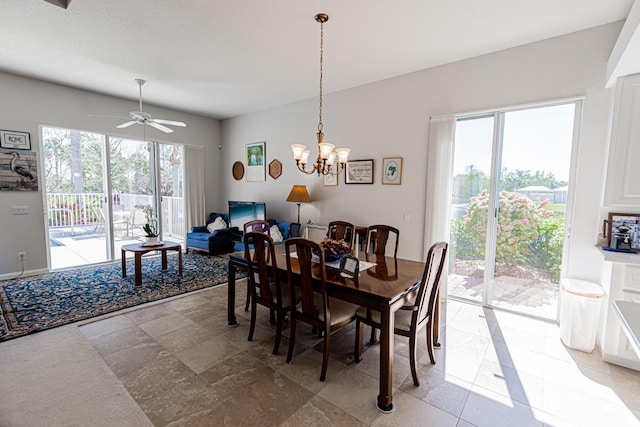 dining room with ceiling fan with notable chandelier