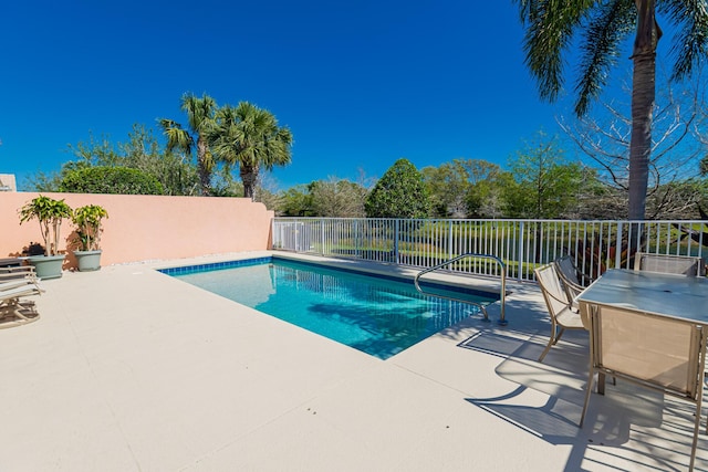 view of pool featuring a fenced in pool, a patio area, and fence