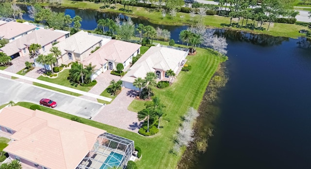 birds eye view of property with a residential view and a water view