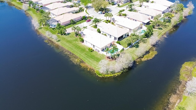 birds eye view of property featuring a residential view and a water view