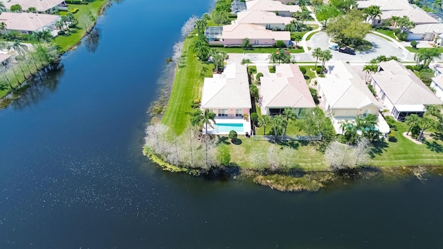 birds eye view of property with a residential view and a water view