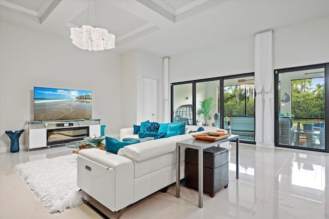 living room with baseboards, coffered ceiling, an inviting chandelier, a high ceiling, and beamed ceiling