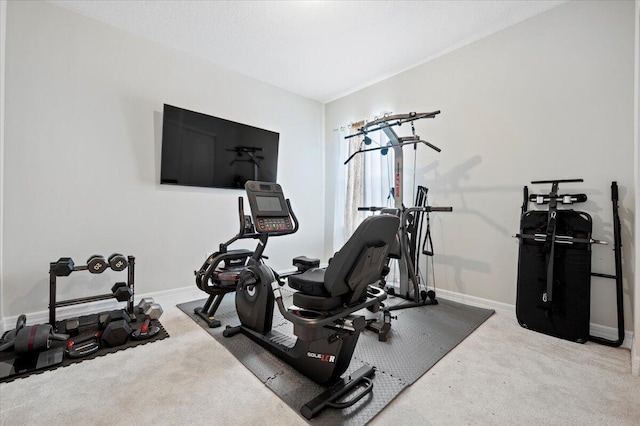 exercise area with carpet flooring and baseboards