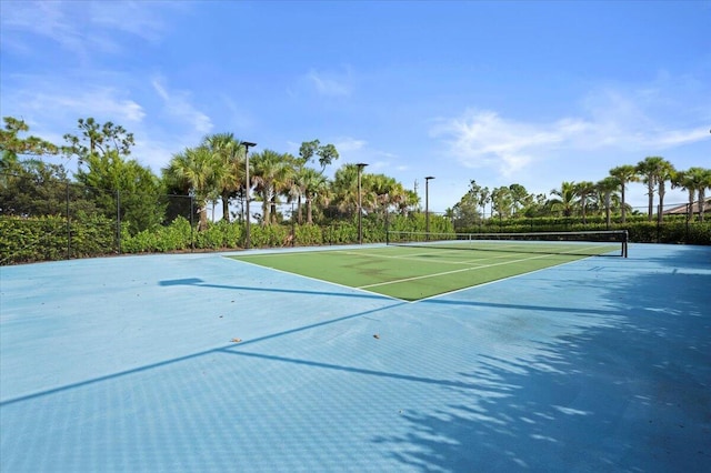 view of sport court with fence