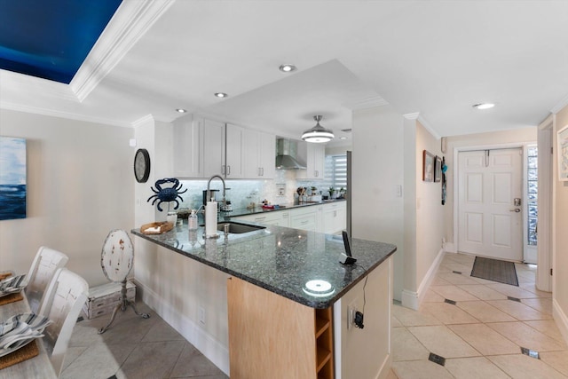 700 NE 20th Ln, Boynton Beach, FL 33435 - kitchen with a sink, light tile patterned flooring, wall chimney exhaust hood, and crown molding