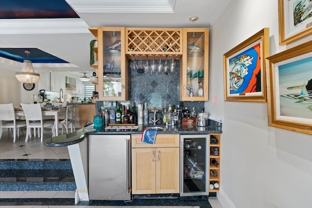 700 NE 20th Ln, Boynton Beach, FL 33435 - bar with beverage cooler, crown molding, tile patterned flooring, decorative backsplash, and bar area