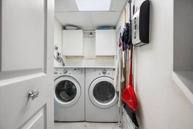 700 NE 20th Ln, Boynton Beach, FL 33435 - laundry area featuring cabinet space and separate washer and dryer