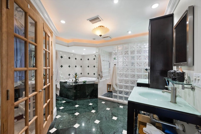 700 NE 20th Ln, Boynton Beach, FL 33435 - full bath with visible vents, ornamental molding, recessed lighting, a bath, and vanity