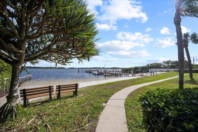 700 NE 20th Ln, Boynton Beach, FL 33435 - view of dock featuring a water view and a lawn