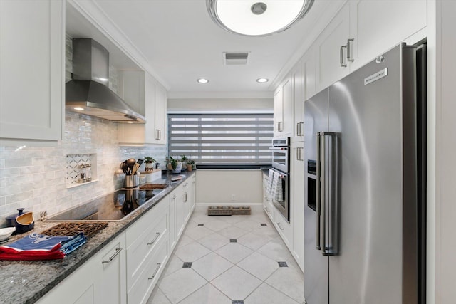 700 NE 20th Ln, Boynton Beach, FL 33435 - kitchen with visible vents, tasteful backsplash, stainless steel appliances, light tile patterned flooring, and wall chimney range hood