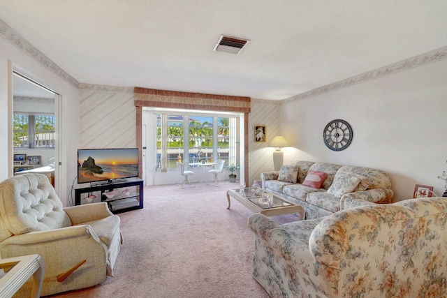 living area with visible vents and carpet floors