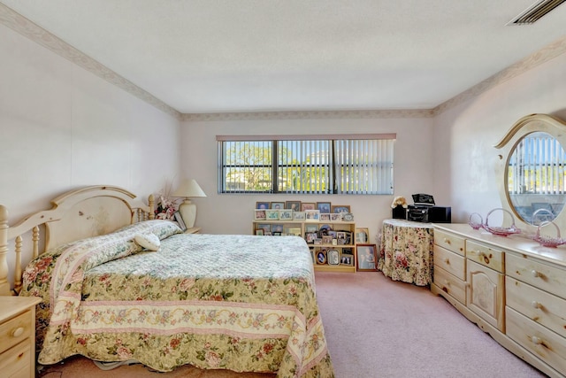 bedroom with visible vents and light colored carpet