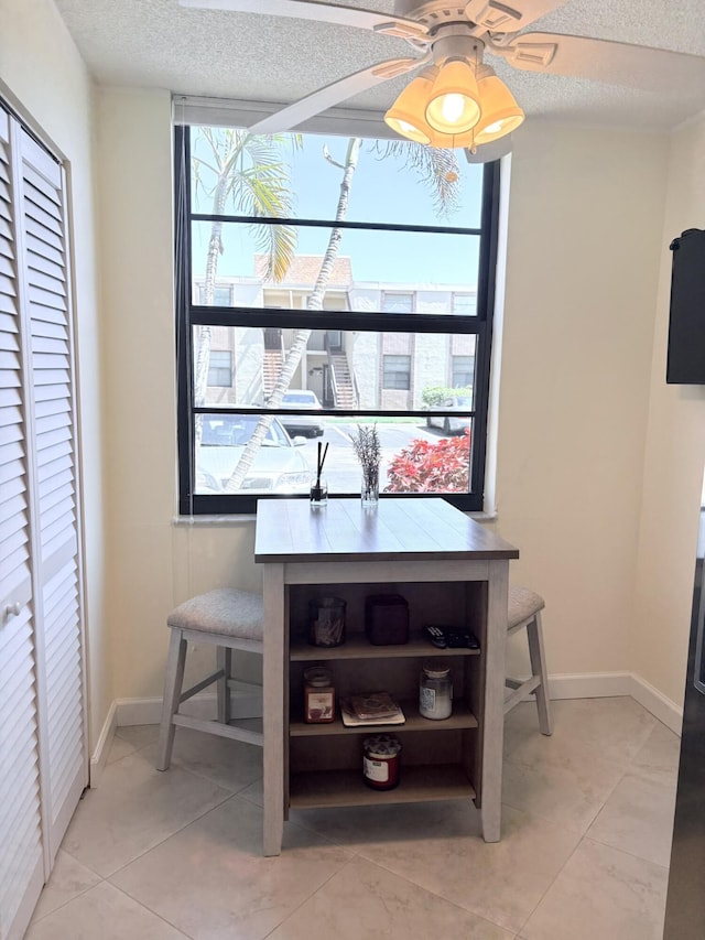 7365 NW 18th St Unit 107, Margate, FL 33063 - detailed view of a textured ceiling, a ceiling fan, and baseboards