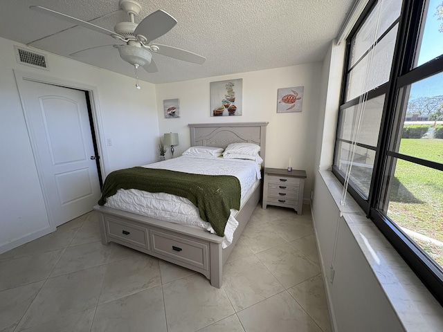 7365 NW 18th St Unit 107, Margate, FL 33063 - bedroom featuring a ceiling fan and a textured ceiling